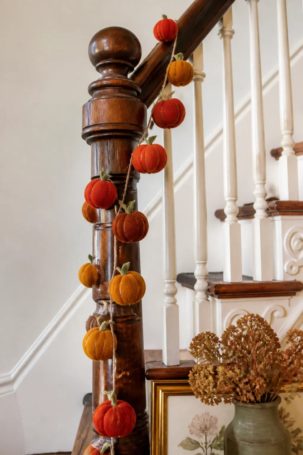 Mini Pumpkin Spiral Staircase Drop — String small stuffed felt pumpkins, about two inches tall, on a long strand of waxed cotton cord. Fall felt garland