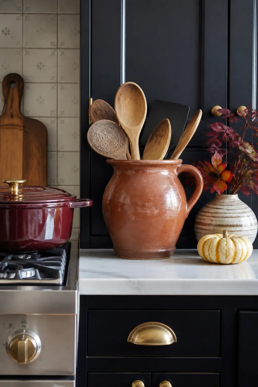 Ceramic Pitcher Holding Wooden Spoons