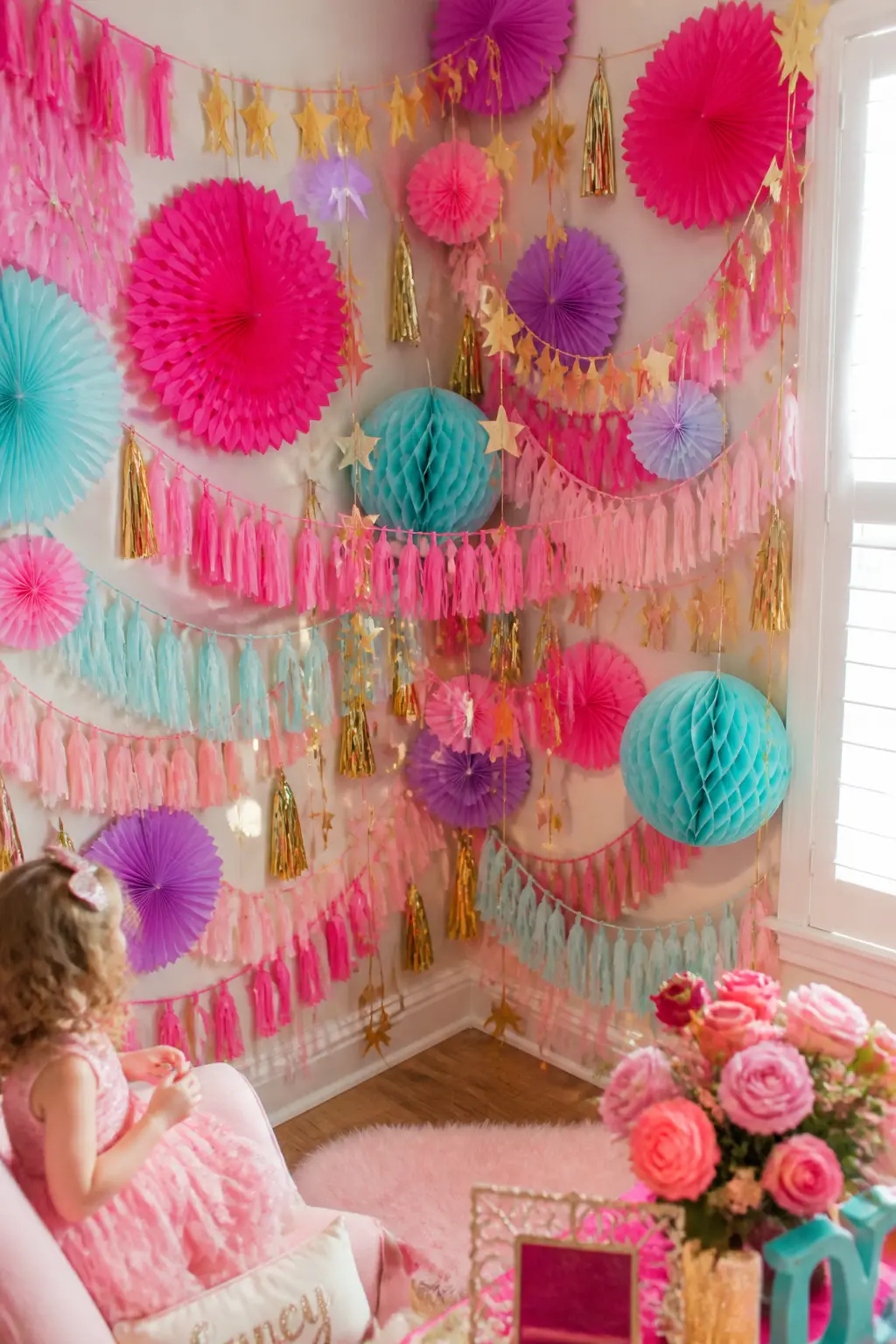 Mixed-Garland Photo Corner — Drape four or five different garlands, paper fans, star strings, ribbon loops, tissue tassels, across a single corner from floor