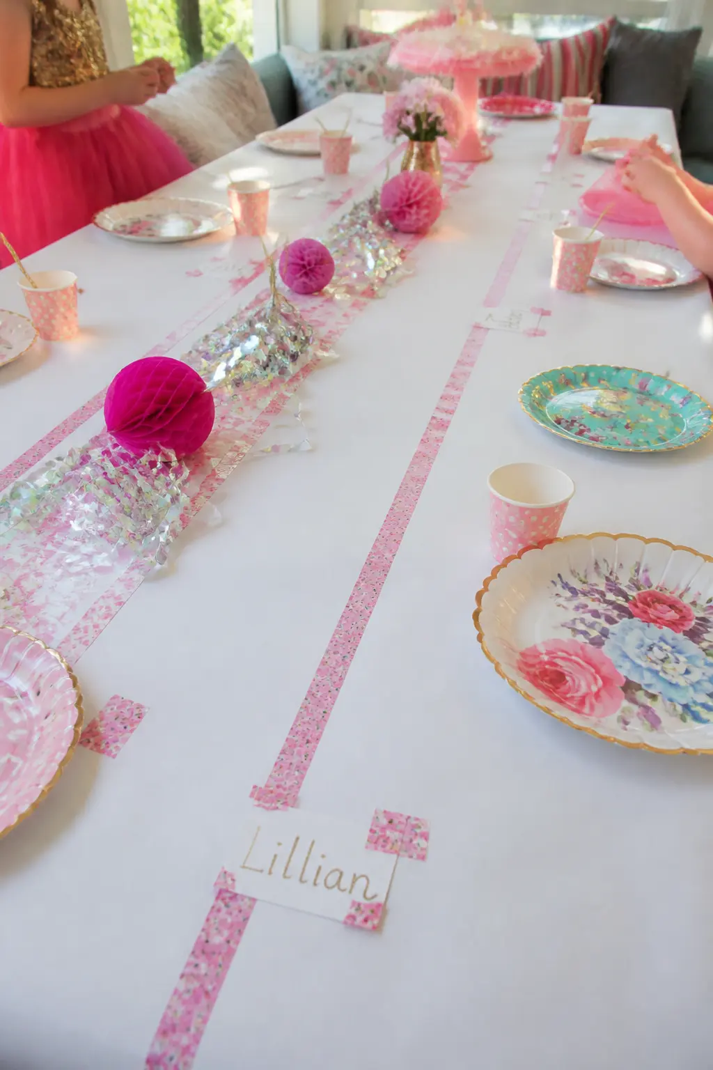 Washi Tape Place Card Runner — Run two parallel strips of floral or polka-dot washi tape down the centre of a plain tablecloth to create a graphic table runner