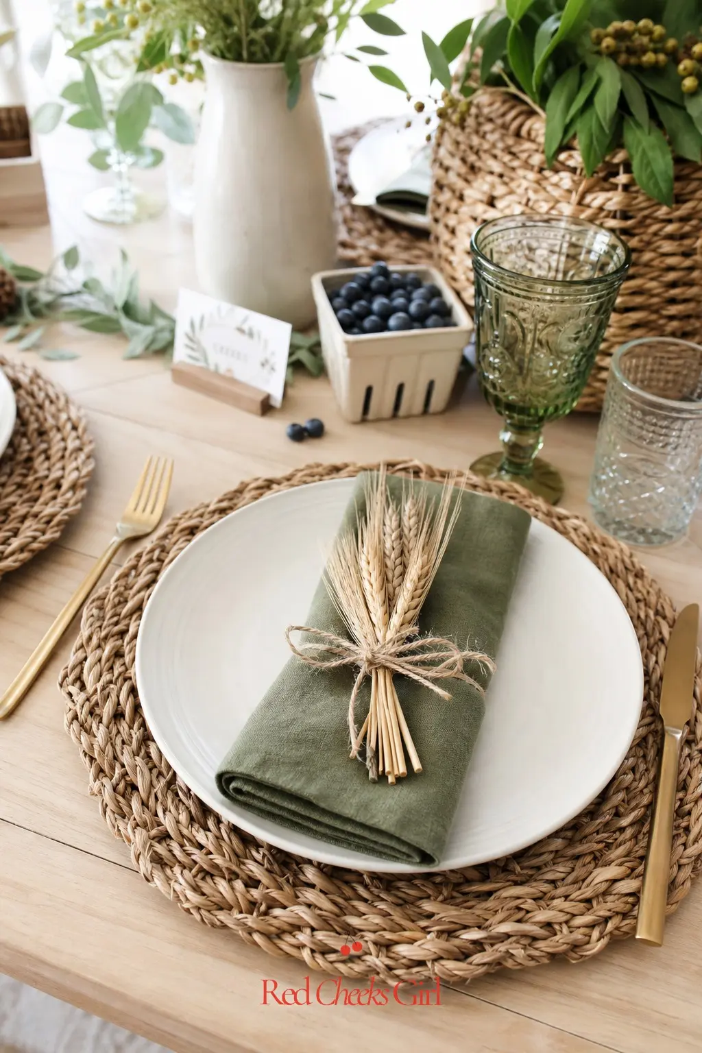 Woven Rattan Charger Table Setting — Rattan chargers under a plain cream plate bring in the basket-and-crate texture of the theme without adding another prop