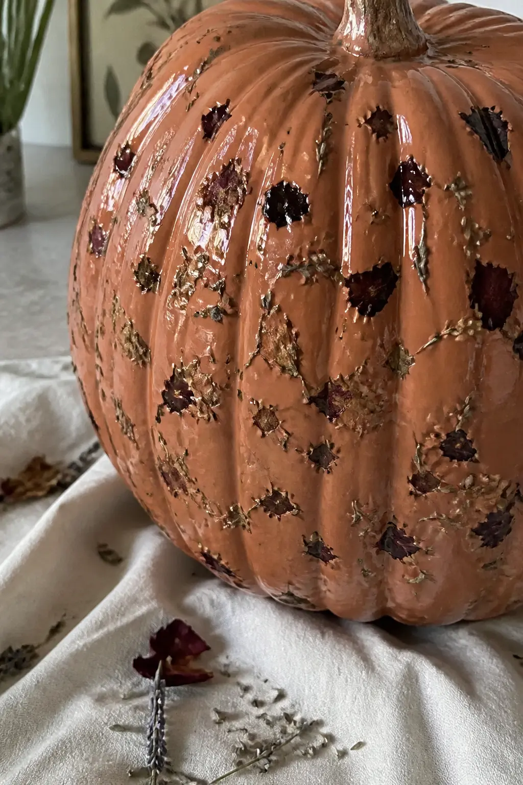 Dried Petals Scattered Into Wet Varnish — This one is tactile and slightly three-dimensional. Floral painted pumpkin