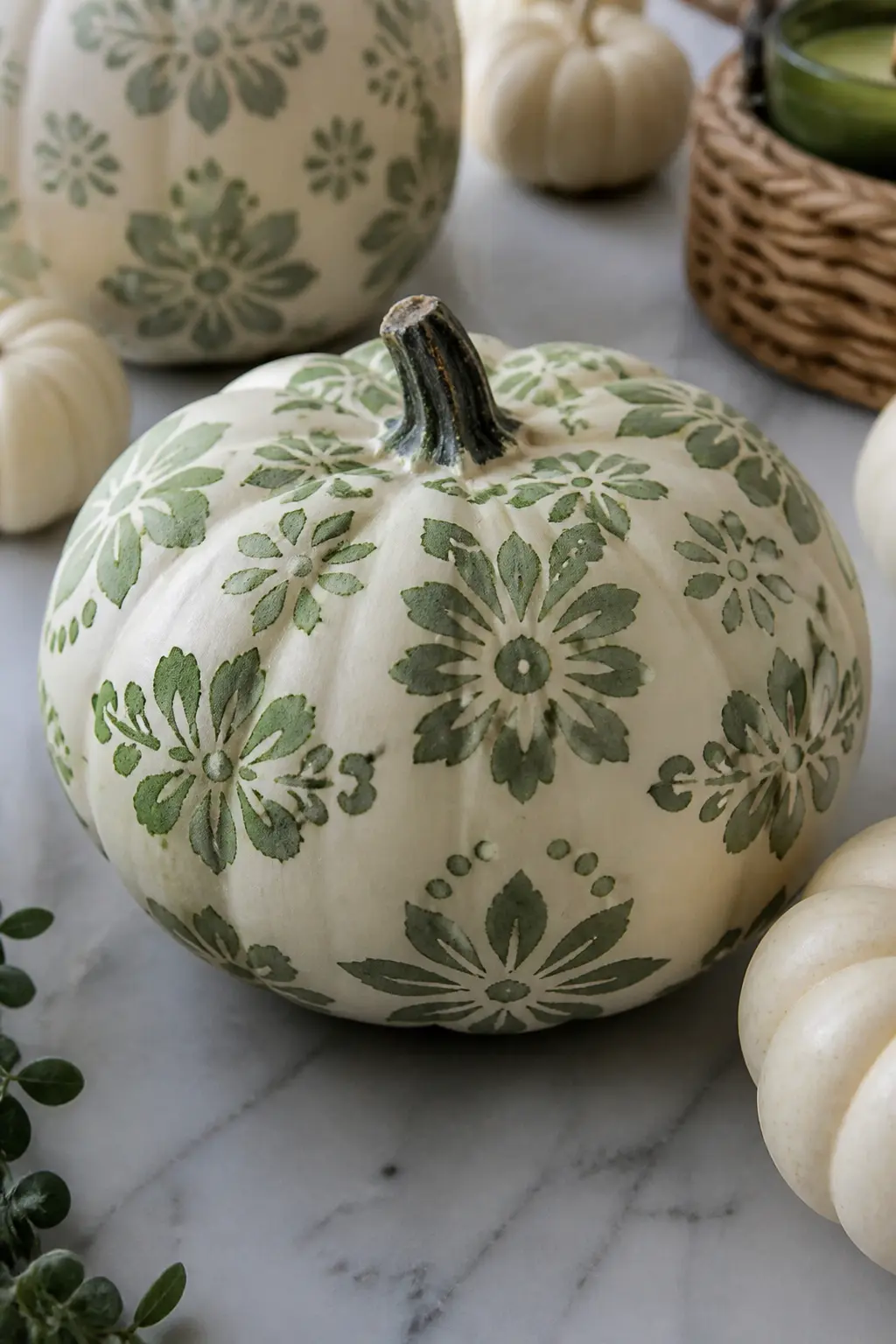 A Stencil Sponged in One Colour — A single-colour stencil is the cleanest and most graphic result available without touching a brush. Floral painted pumpkin