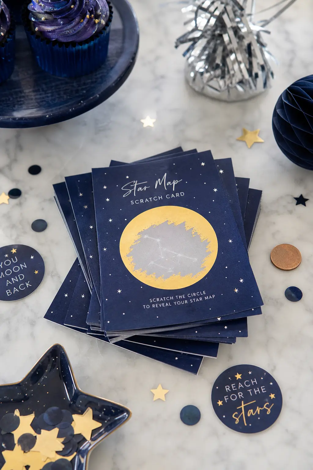 Star Map Scratch Cards — A navy card coated in a gold foil scratch layer over a printed silver constellation reveals the pattern only once a coin or fingernail