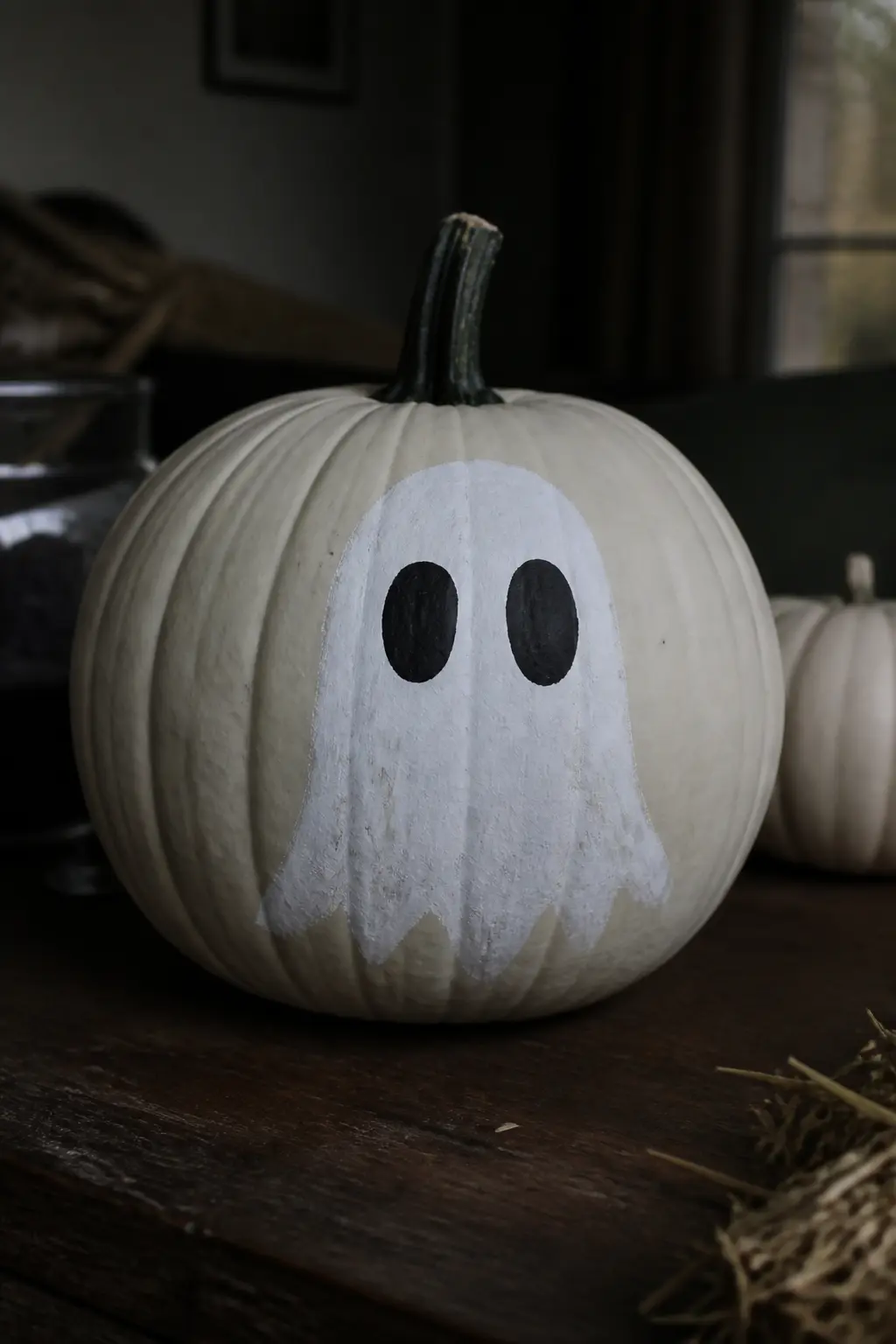 Ghost With Hollow Oval Eyes and No Mouth — The eyes are not dots. Ghost painted pumpkin
