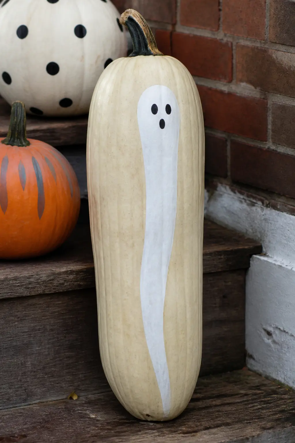 Ghost With a Very Long Thin Body — The head is normal in proportion. Ghost painted pumpkin