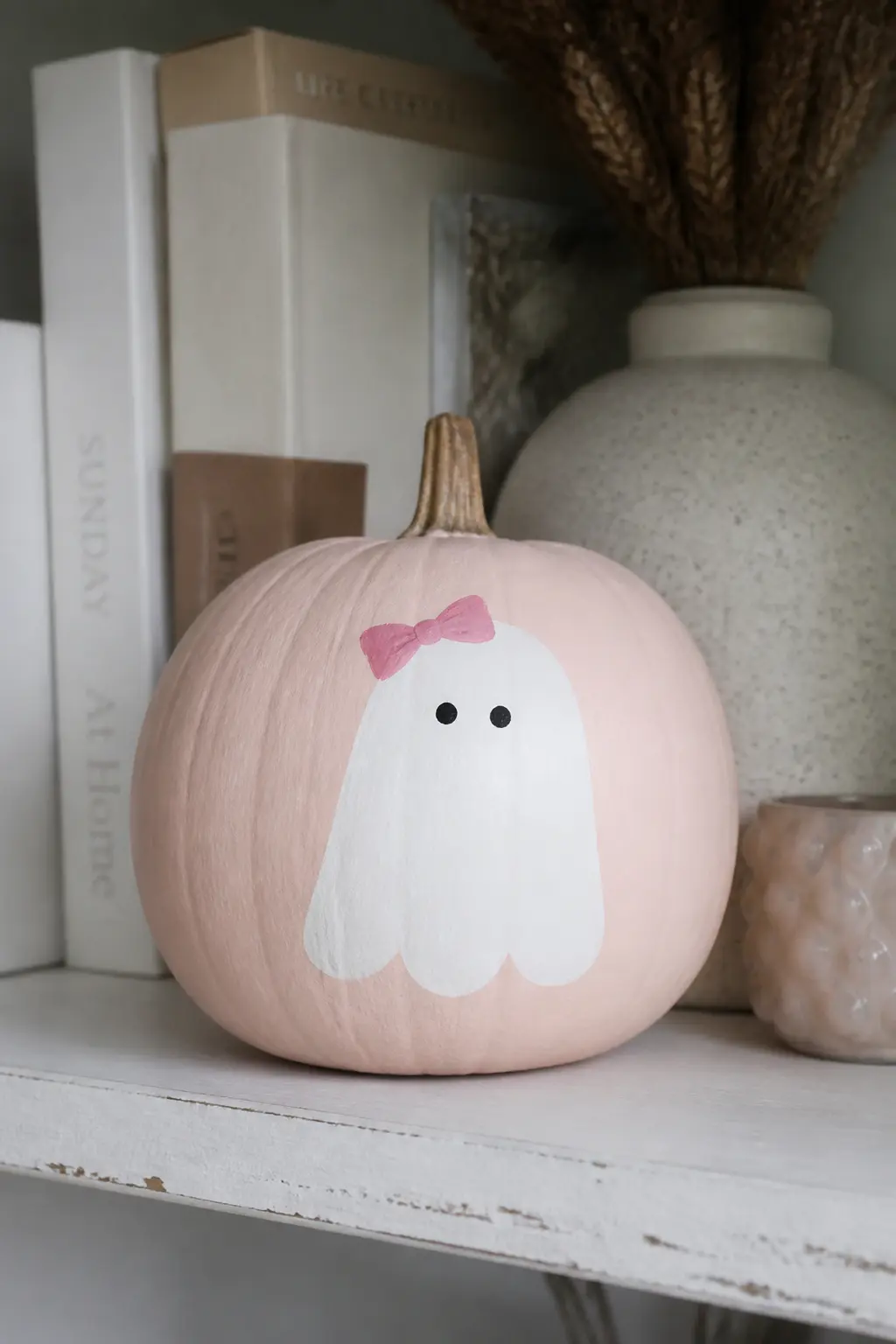 Ghost Wearing a Painted Bow — A small bow sits at the top of the ghost's head, painted in pink, red, or black depending on how sweet or graphic you want the