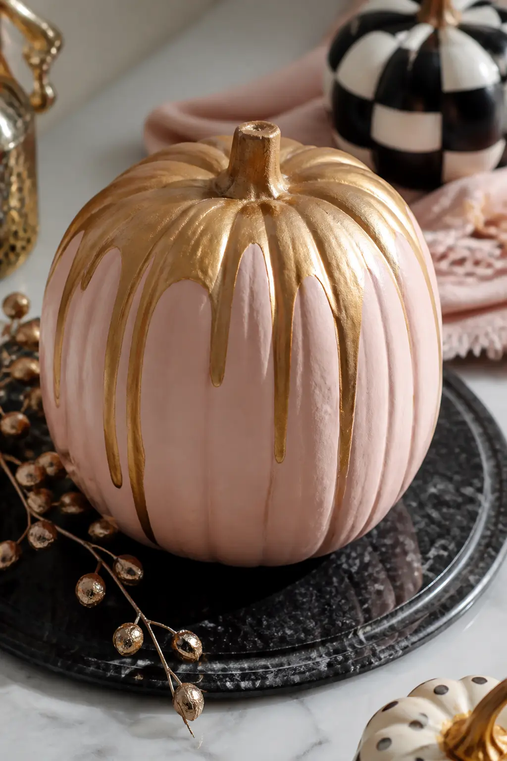 Blush Pumpkin With Gold Marbling Poured Over the Top Half — Paint the full pumpkin in blush and let it cure for 24 hours. Girly painted pumpkin