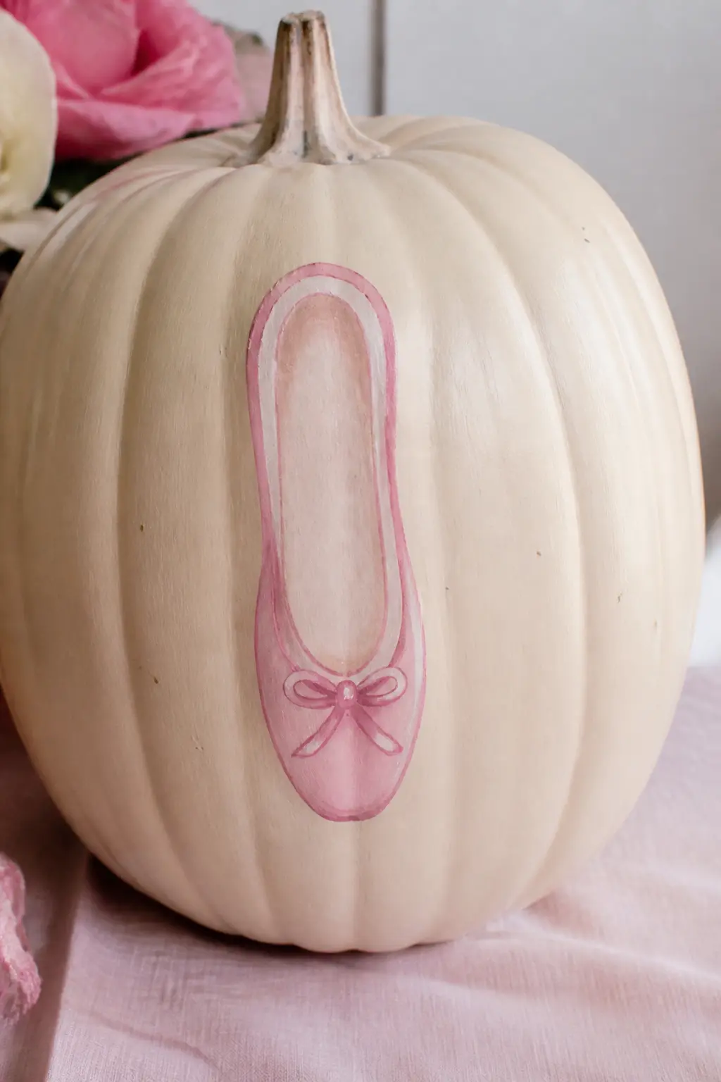 Cream Pumpkin With a Painted Pink Ballet Slipper on the Front — Paint the pumpkin in cream. Girly painted pumpkin
