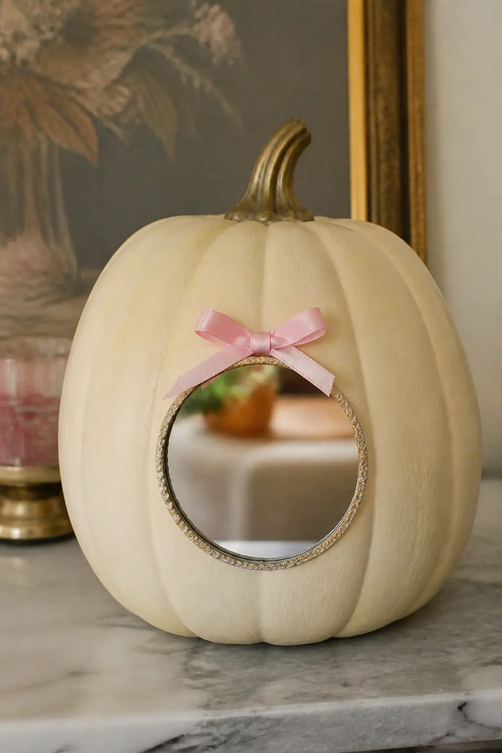 Cream Pumpkin With a Small Mirror Glued on the Front and a Bow Above It — Paint the pumpkin in cream. Girly painted pumpkin