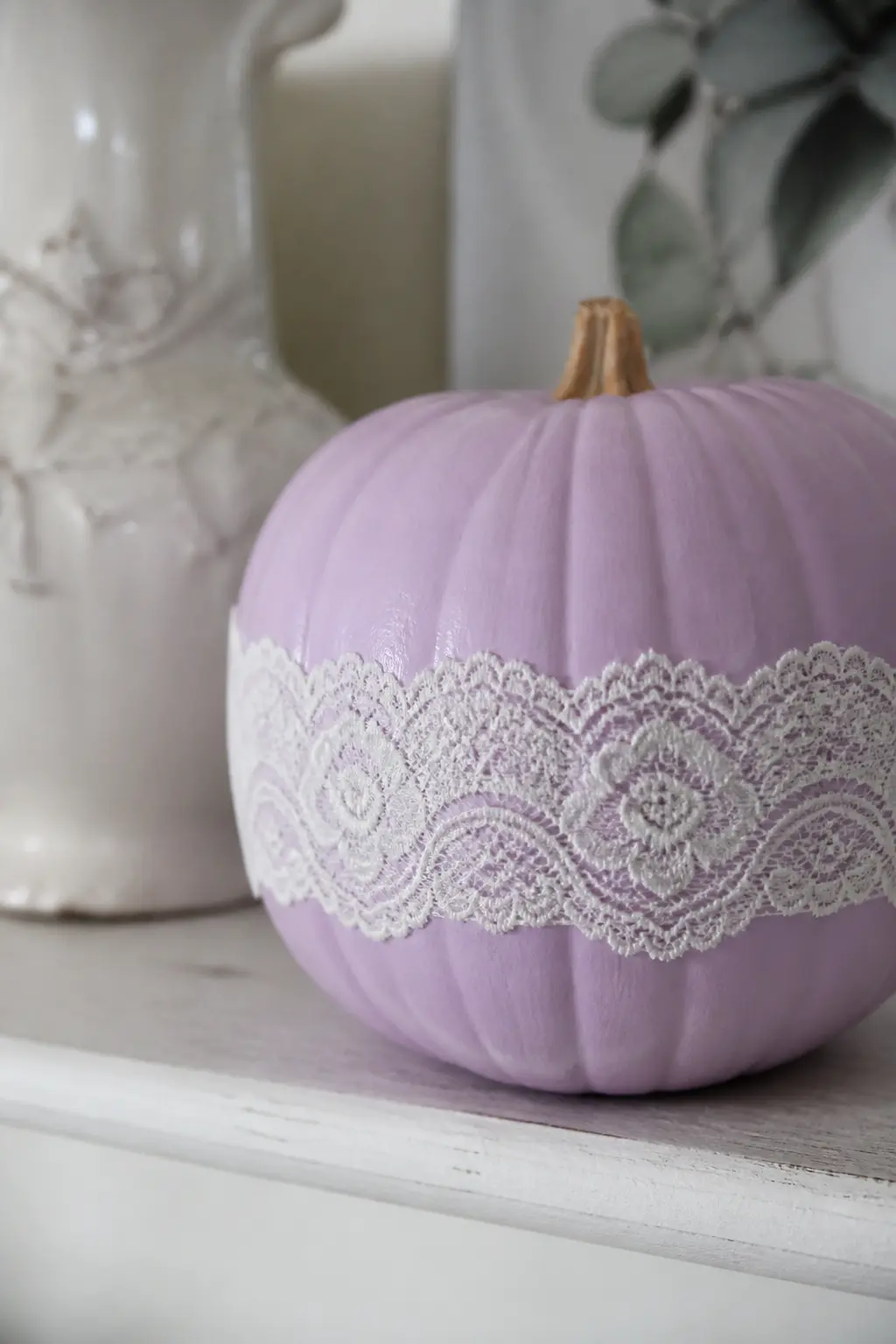 Lilac Pumpkin With a Lace Ribbon Glued Around the Middle — Paint the pumpkin in lilac and let it dry fully. Girly painted pumpkin