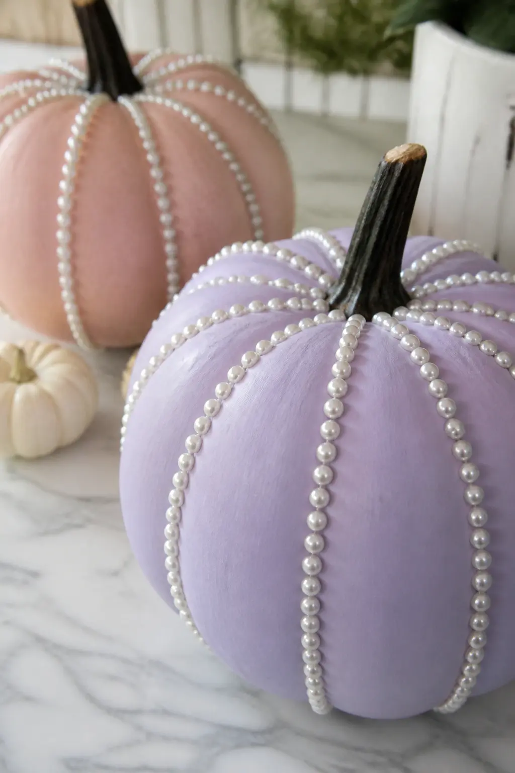 Lilac Pumpkin With Pearls Glued Only Along the Ridges — Paint the pumpkin in lilac and cure fully. Girly painted pumpkin