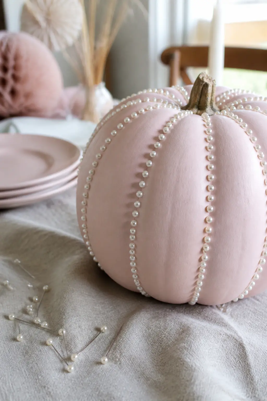 Pale Pink Pumpkin With Pearl-Headed Pins Along Every Ridge — Paint a faux pumpkin in pale pink with a matte finish. Girly painted pumpkin