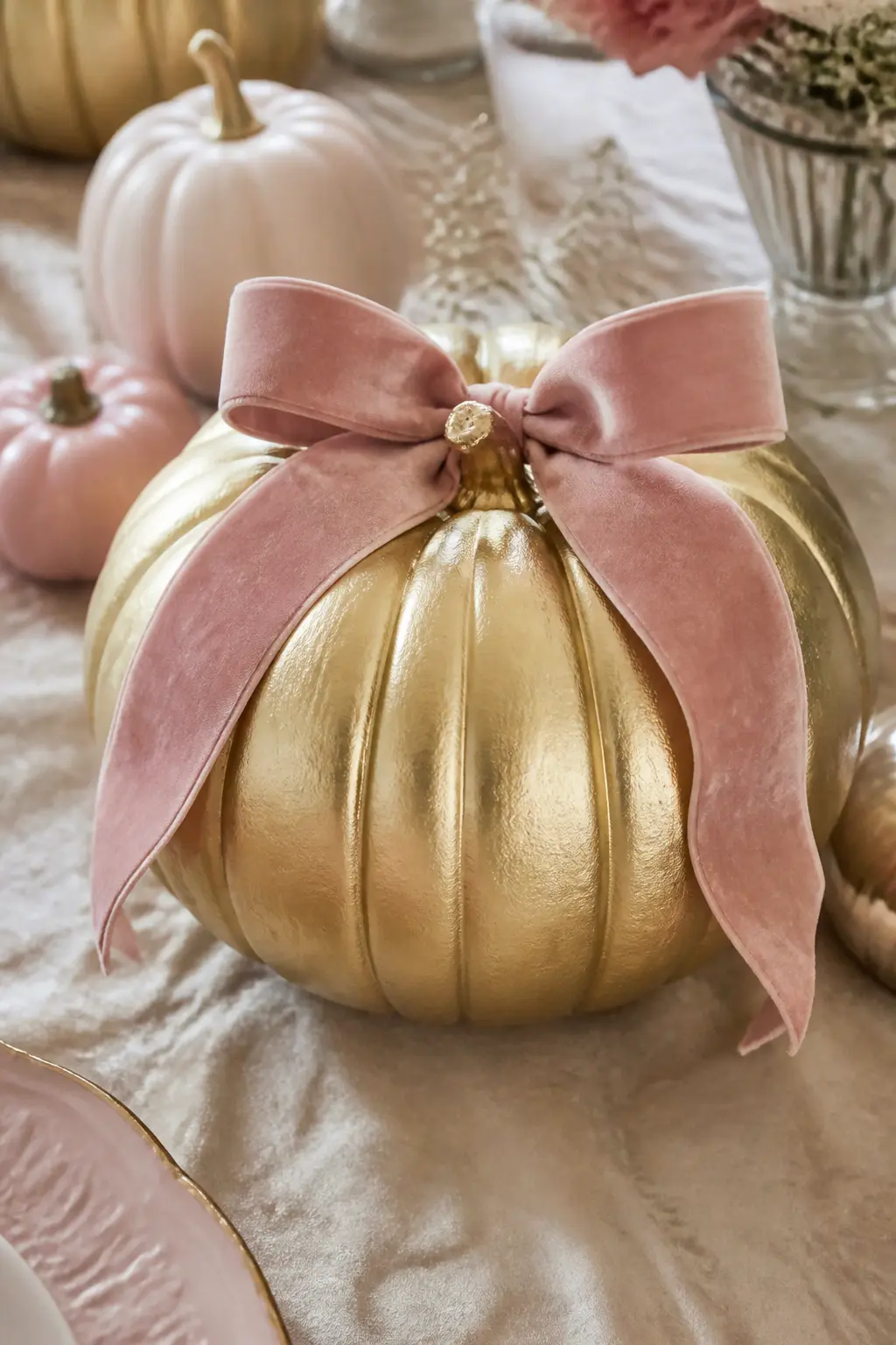 Soft Gold Pumpkin With a Blush Velvet Ribbon Bow on Top — Paint the pumpkin in soft gold using a metallic craft paint. Girly painted pumpkin