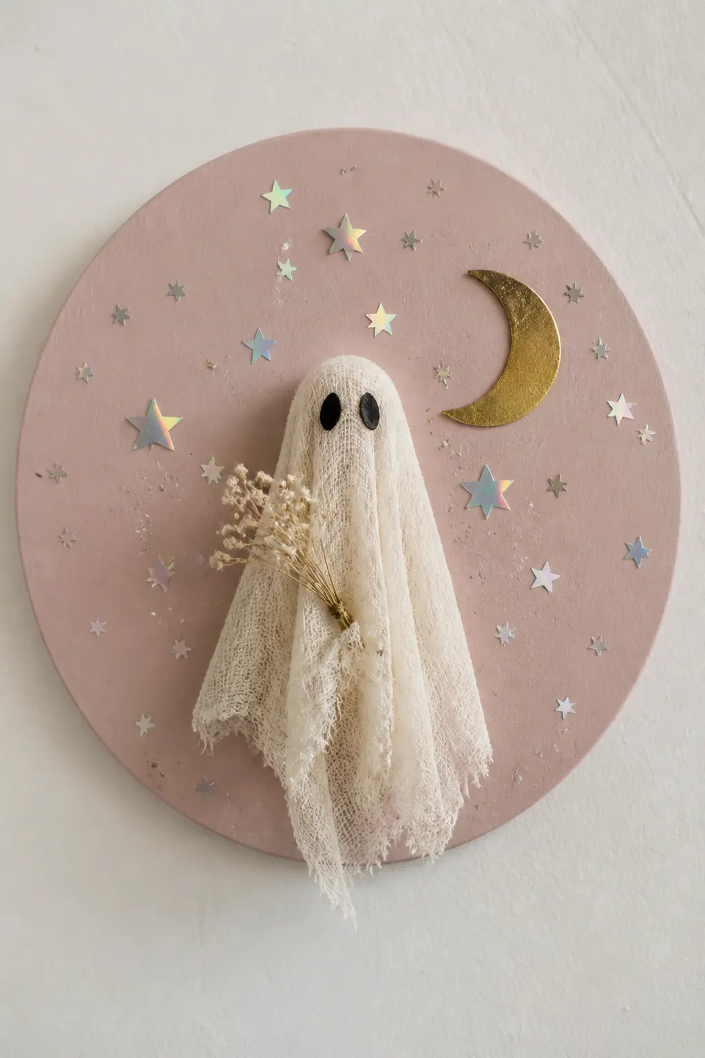 Cheesecloth Ghost on a Painted Wood Round — Paint a 10-inch wood round in dusty blush or warm terracotta. Glitter crafts