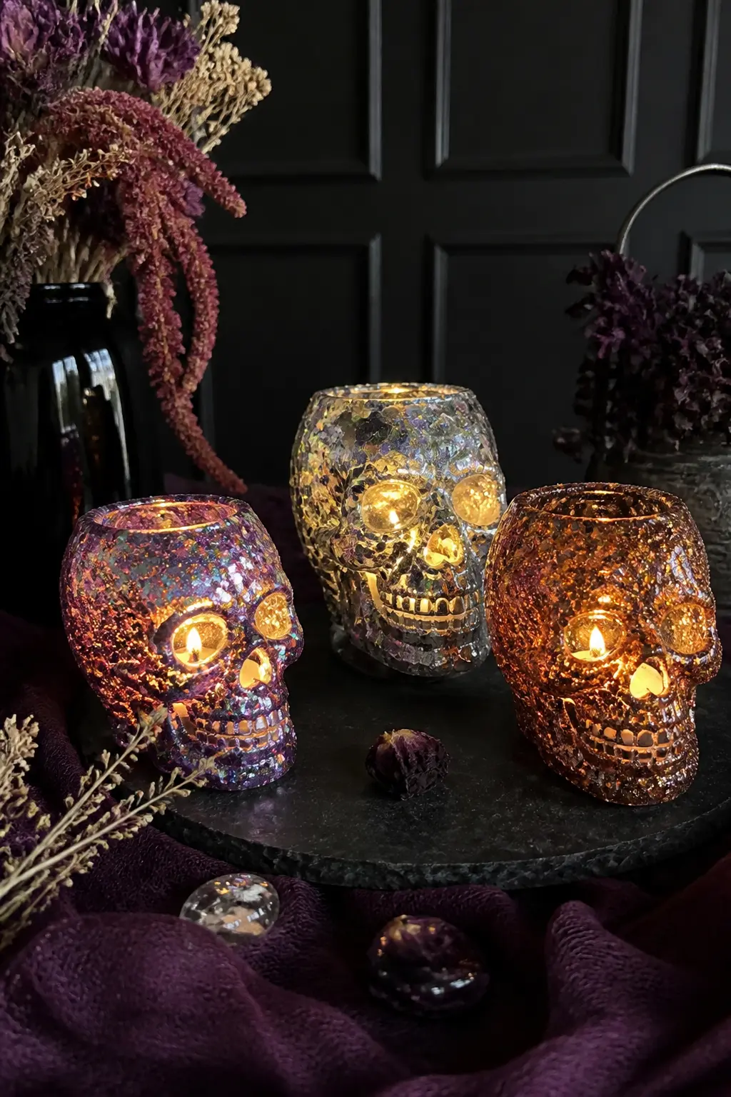 Glitter and Resin Skull Votives — Coat the outside of small glass skull votives in a thin layer of Mod Podge using a foam brush, working one section at a time.