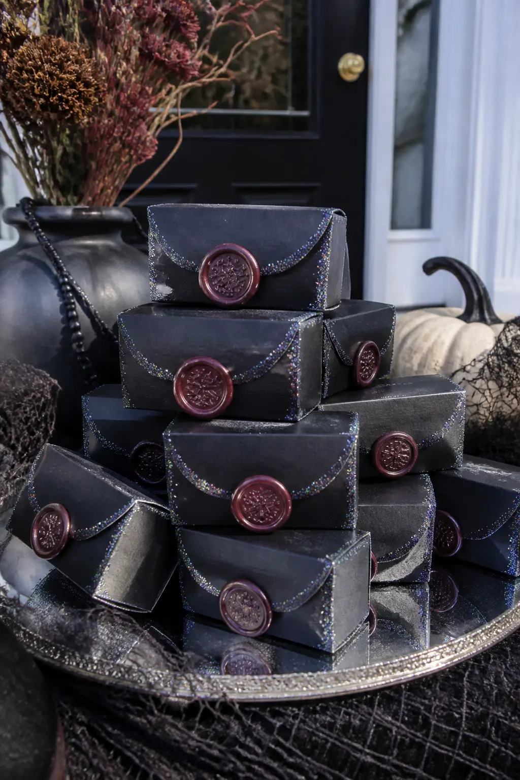 Glitter Wax Seal Favour Boxes — Fold small black card boxes from a template and fill with a single chocolate truffle, a packet of salted caramel, or a small