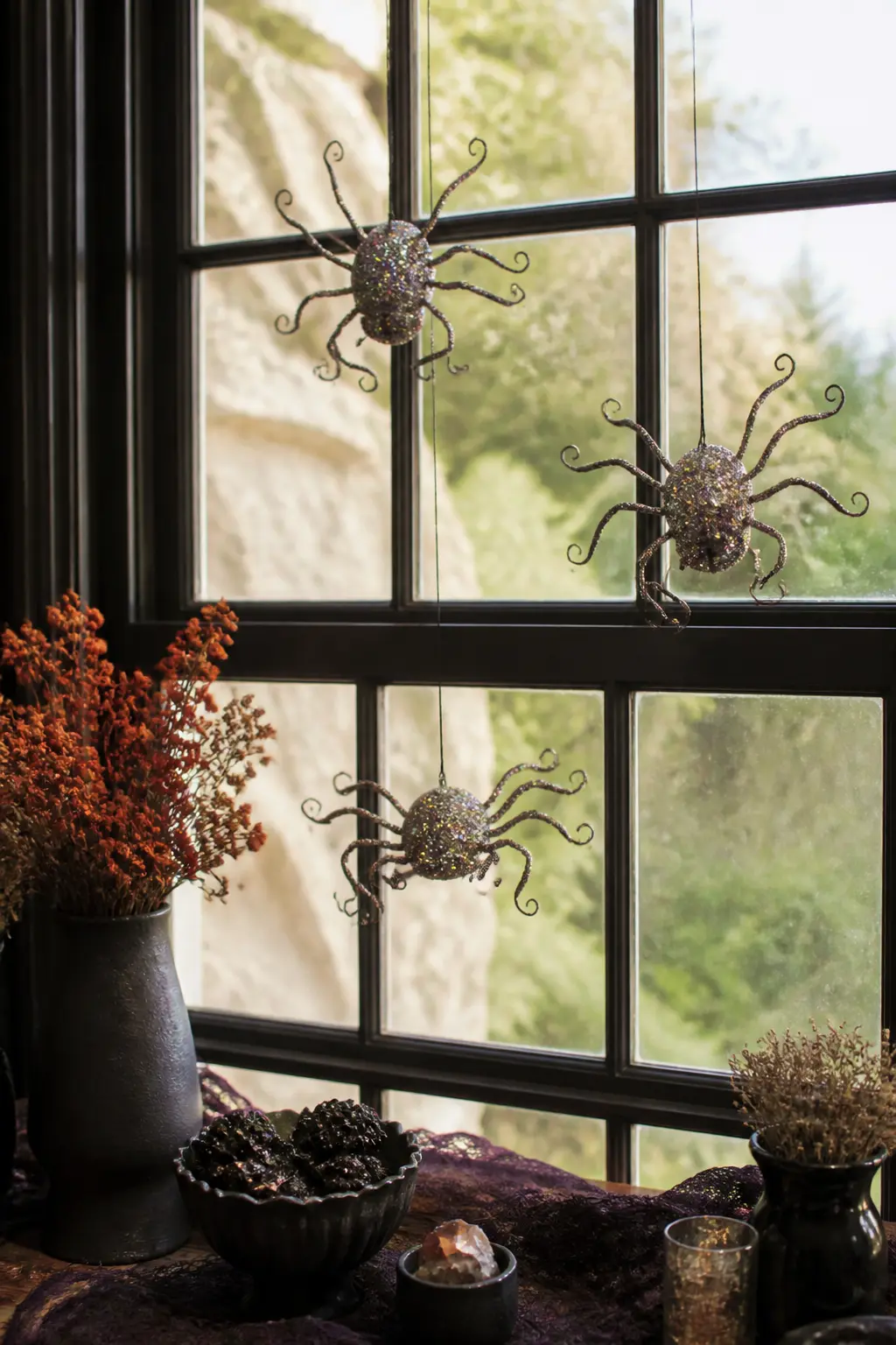Glittered Acrylic Spiders on Wire — Cut simple spider body shapes from black craft foam, coat them in Mod Podge, and drop them into a bag of iridescent chunky