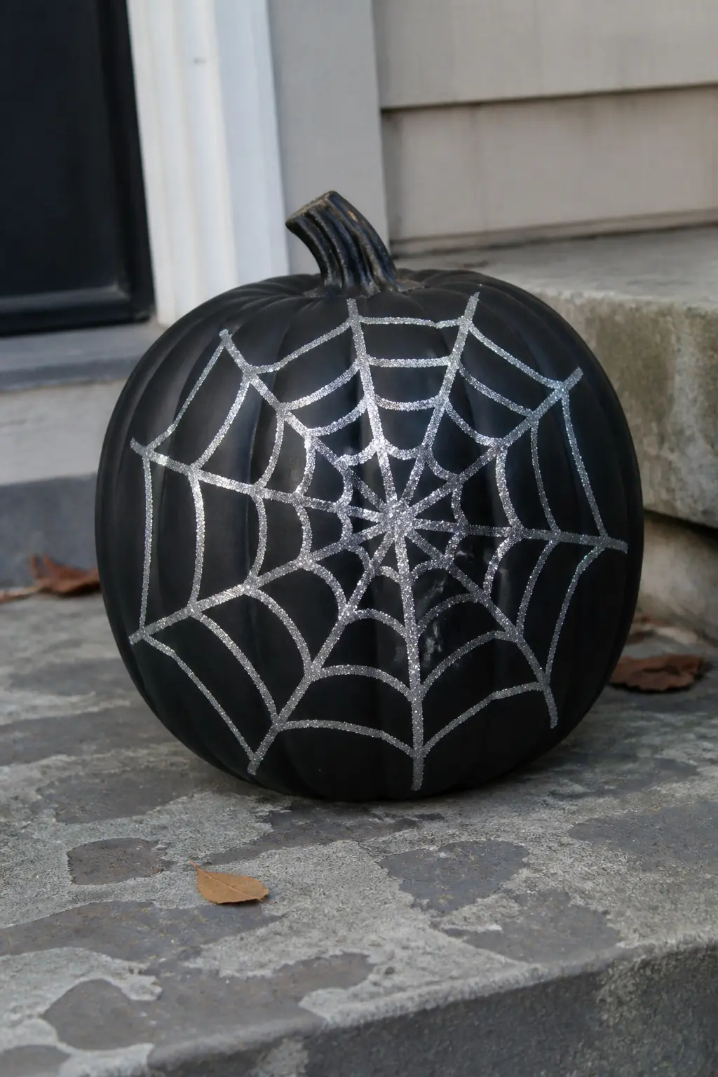 Black Pumpkin With a Silver Glitter Spider Web — Paint the pumpkin matte black. Glitter pumpkin
