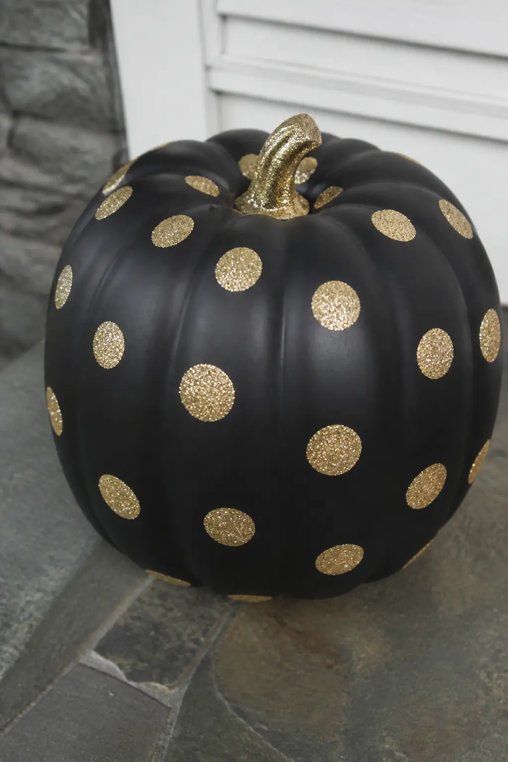 Matte Black Pumpkin With Gold Glitter Polka Dots — Paint the pumpkin matte black. Glitter pumpkin