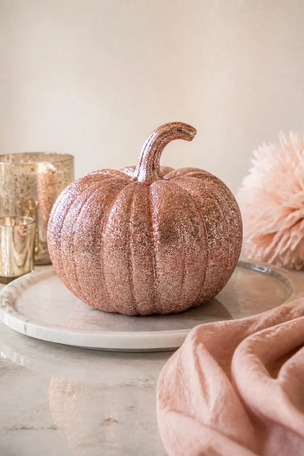 Rose Gold Glitter Pumpkin Over a Blush Base — Mix blush pink and a drop of white to get a soft base coat, then cover the whole surface with rose gold glitter