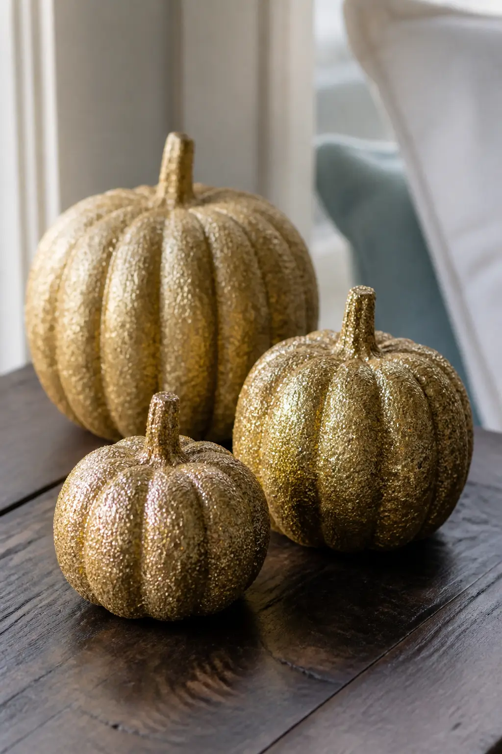 Set of Three Glitter Pumpkins in Graduated Sizes, Same Gold — Cover three pumpkins in the same fine gold glitter, the same density, the same base coat, but in