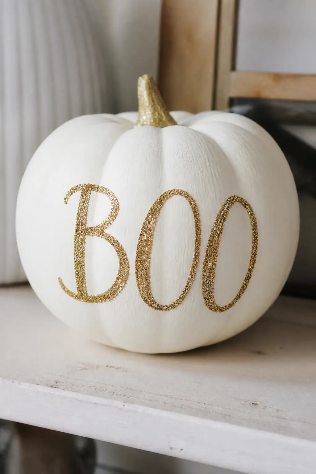 White Pumpkin With a Hand-Lettered Word in Gold Glitter — Paint the pumpkin matte white. Glitter pumpkin
