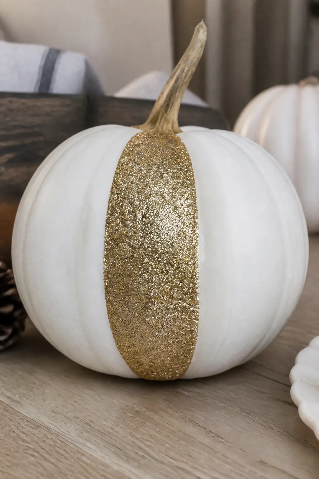 White Pumpkin With One Glittered Section Like a Slice — Paint the pumpkin white. Glitter pumpkin