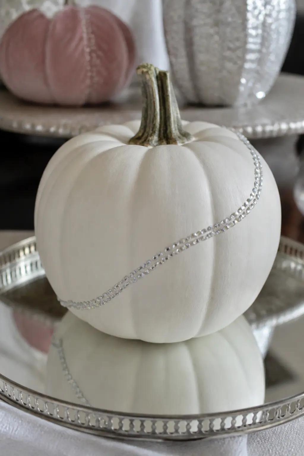 White Pumpkin With Rhinestones in a Curving Line Only — Paint the pumpkin matte white. Glitter pumpkin