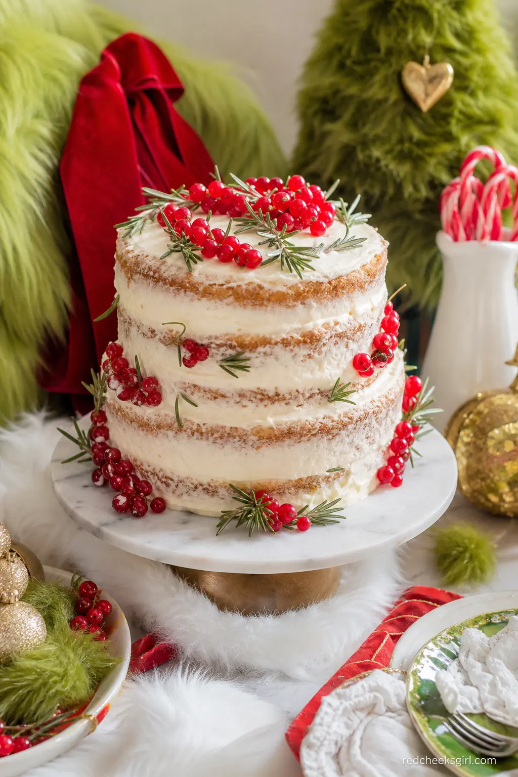 The Naked Heart Cake — A cream frosted naked cake, its layers just visible through a thin coat of icing, studded with fresh red currants and small sprigs of