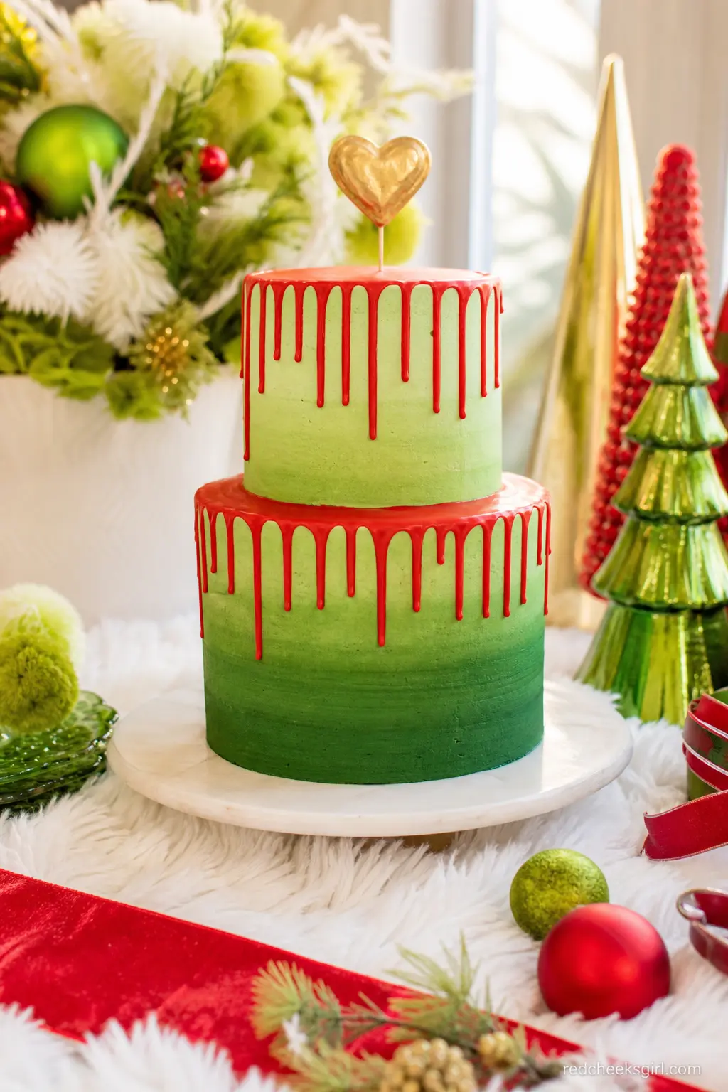 The Two-Sizes-Too-Small Ombre Cake — A two tier cake iced in shaded green buttercream, deep at the base and paling toward the top, finished with a cherry red