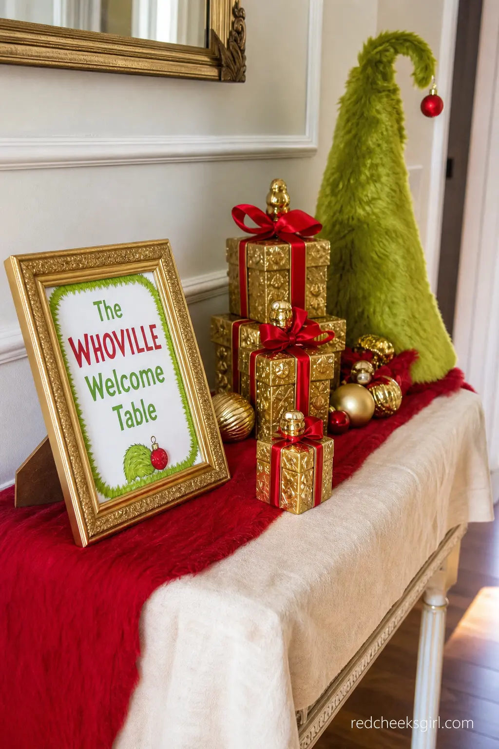 The Whoville Welcome Table — A narrow entry table dressed in a cream cloth with a red runner gives guests somewhere to sign a card, drop off a gift, and pause