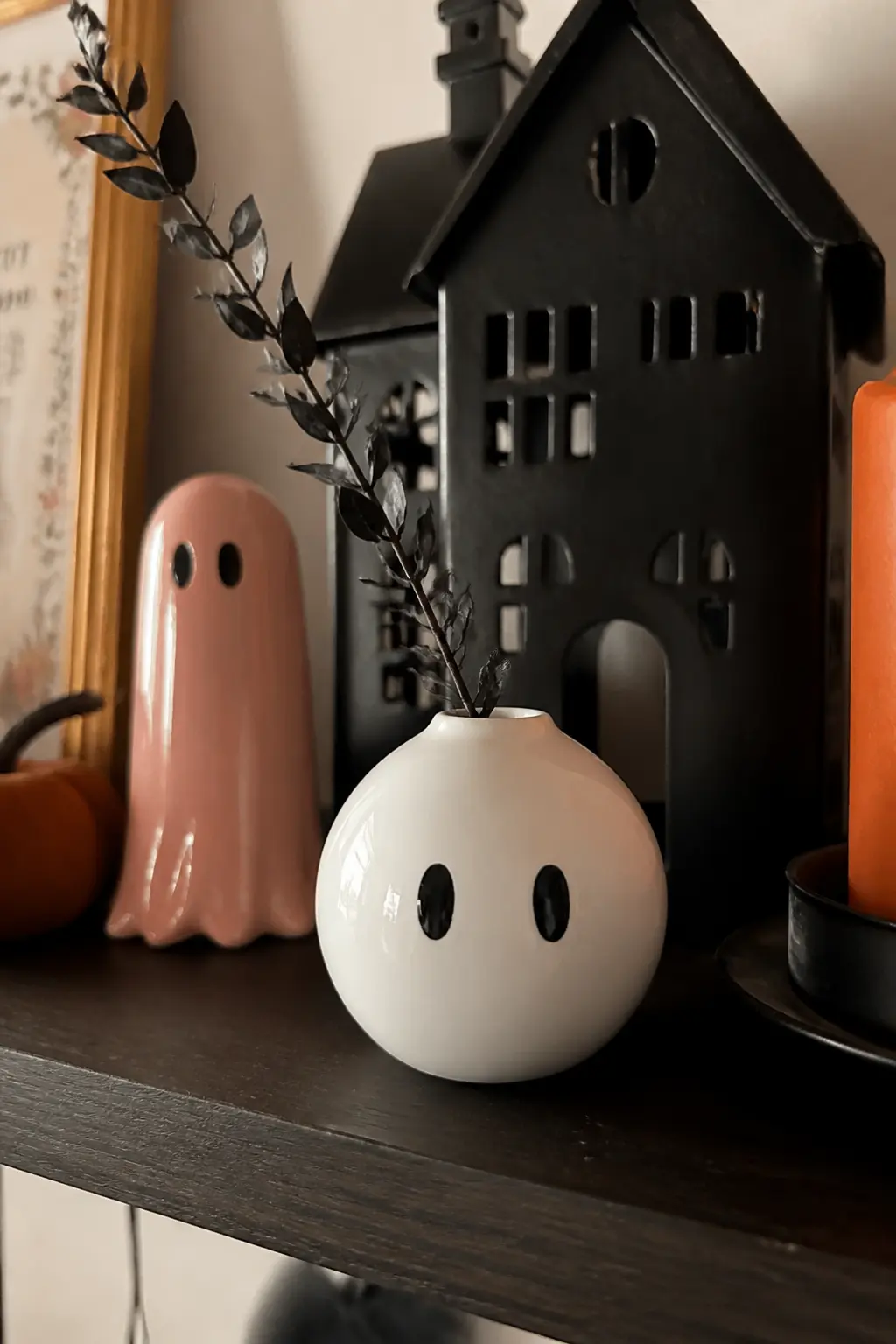 Painted Bisque Ghost Vase — A plain white ceramic bud vase from a craft store becomes a ghost in about twenty minutes. Halloween ceramics ideas
