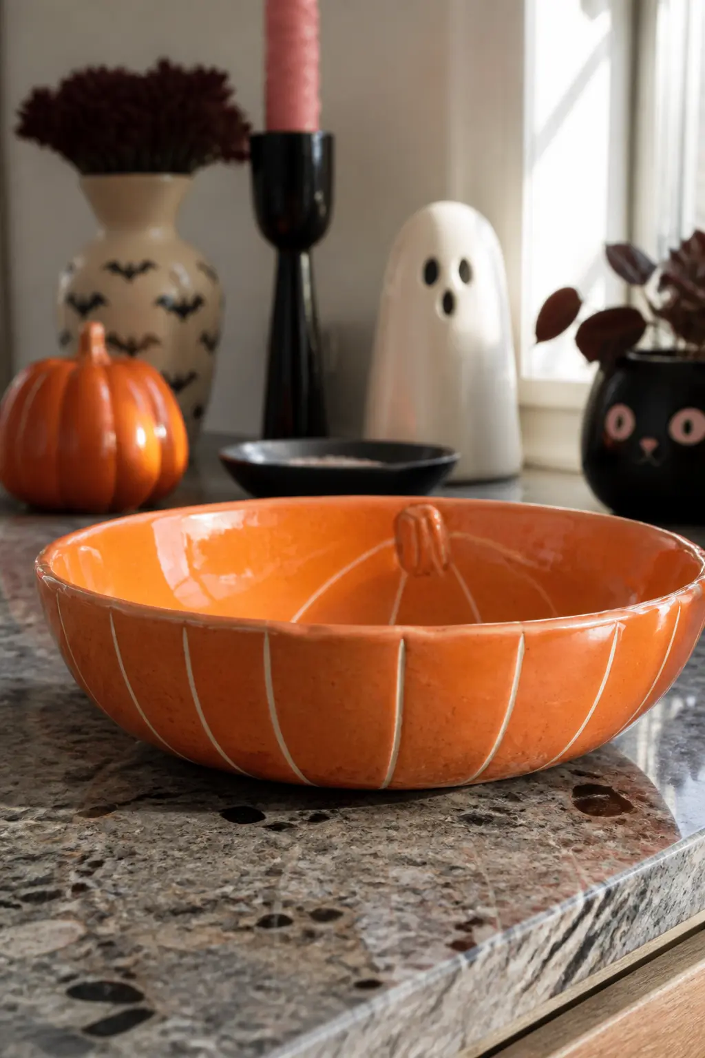 Sgraffito-Style Pumpkin Bowl — Sgraffito is the technique of scratching through a top layer of colour to reveal the layer beneath. Halloween ceramics ideas