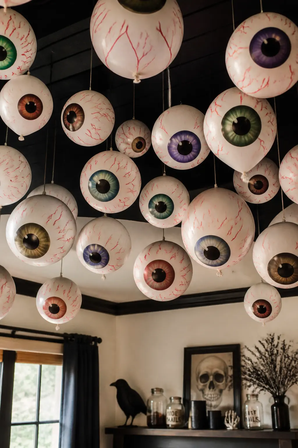 Bloodshot Balloon Ceiling Cloud — Inflate white balloons to varying sizes and draw red veins outward from a coloured iris painted or drawn near the knot end.