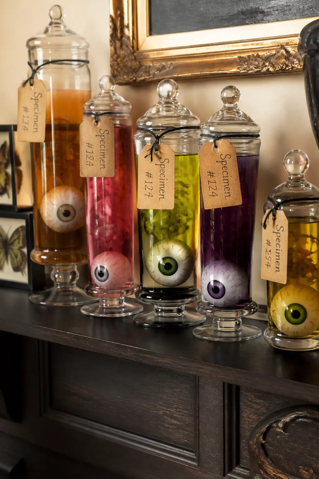 Eyeball Apothecary Jar Shelf — Line a shelf with tall apothecary jars or clip-top glass bottles, each filled with a different liquid colour and a small