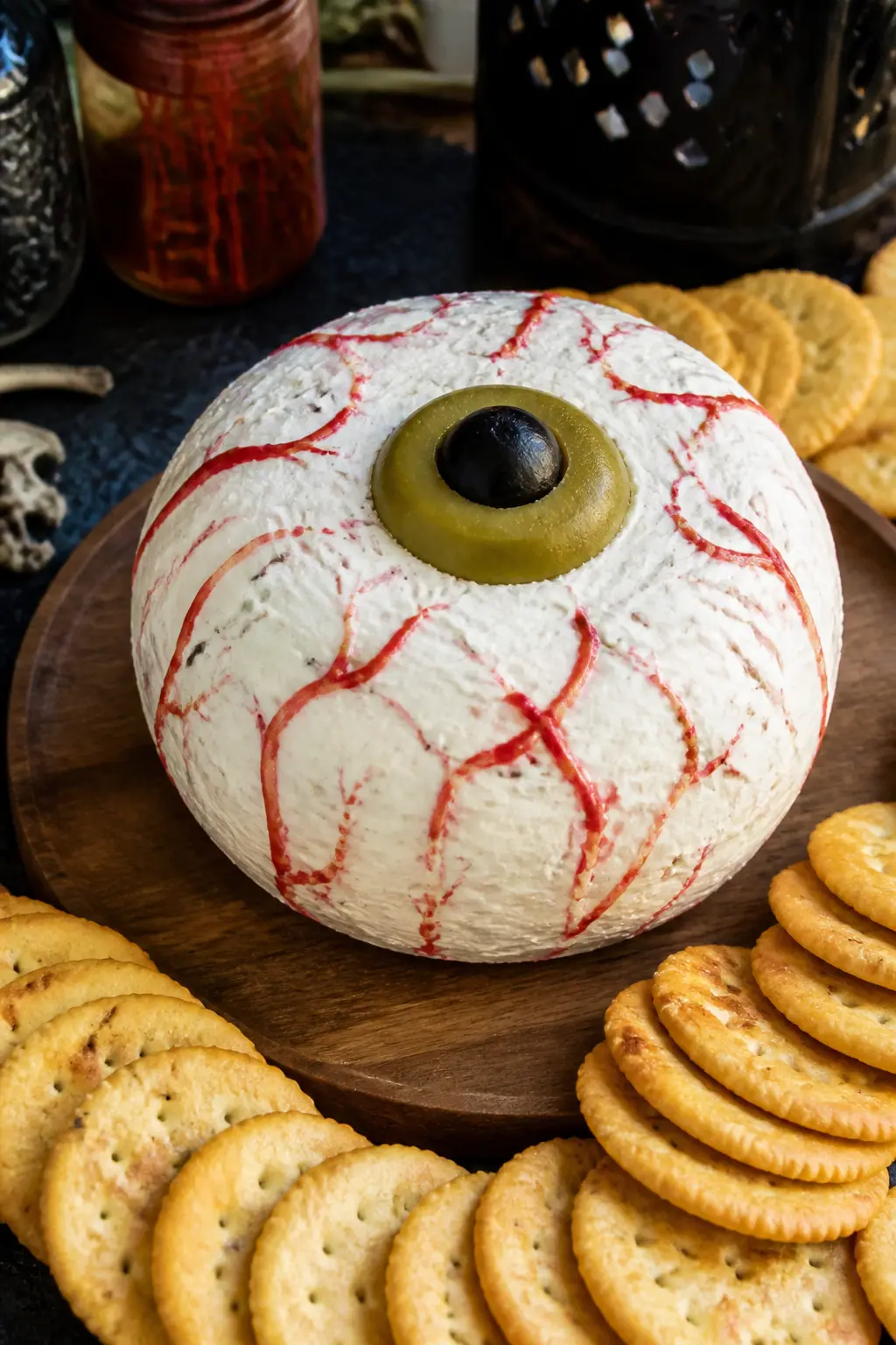 Eyeball Cheese Ball — Shape a cream cheese and cheddar mixture into a smooth round ball and chill until firm. Halloween decorations diy eyeballs