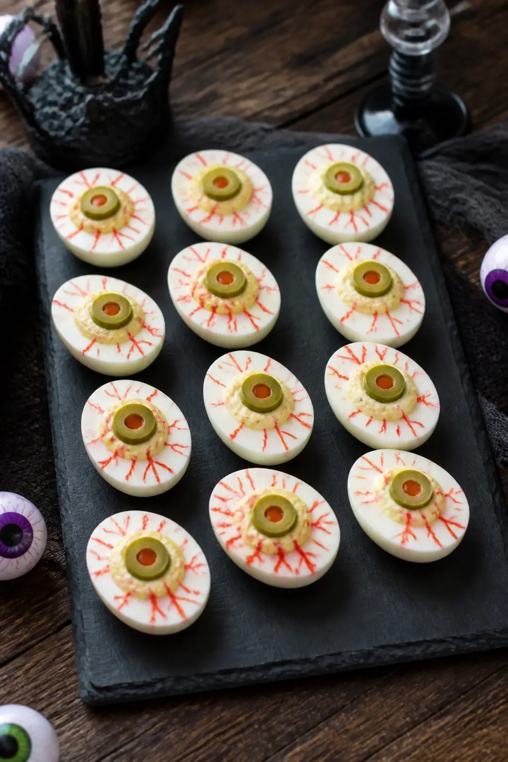 Eyeball Devilled Eggs — Make devilled eggs in the usual way, then pipe the yolk filling into a smooth dome rather than the standard piped swirl. Halloween