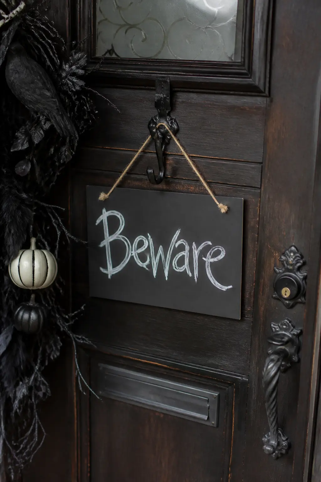 Door Number Swapped for a Spooky Handwritten Sign