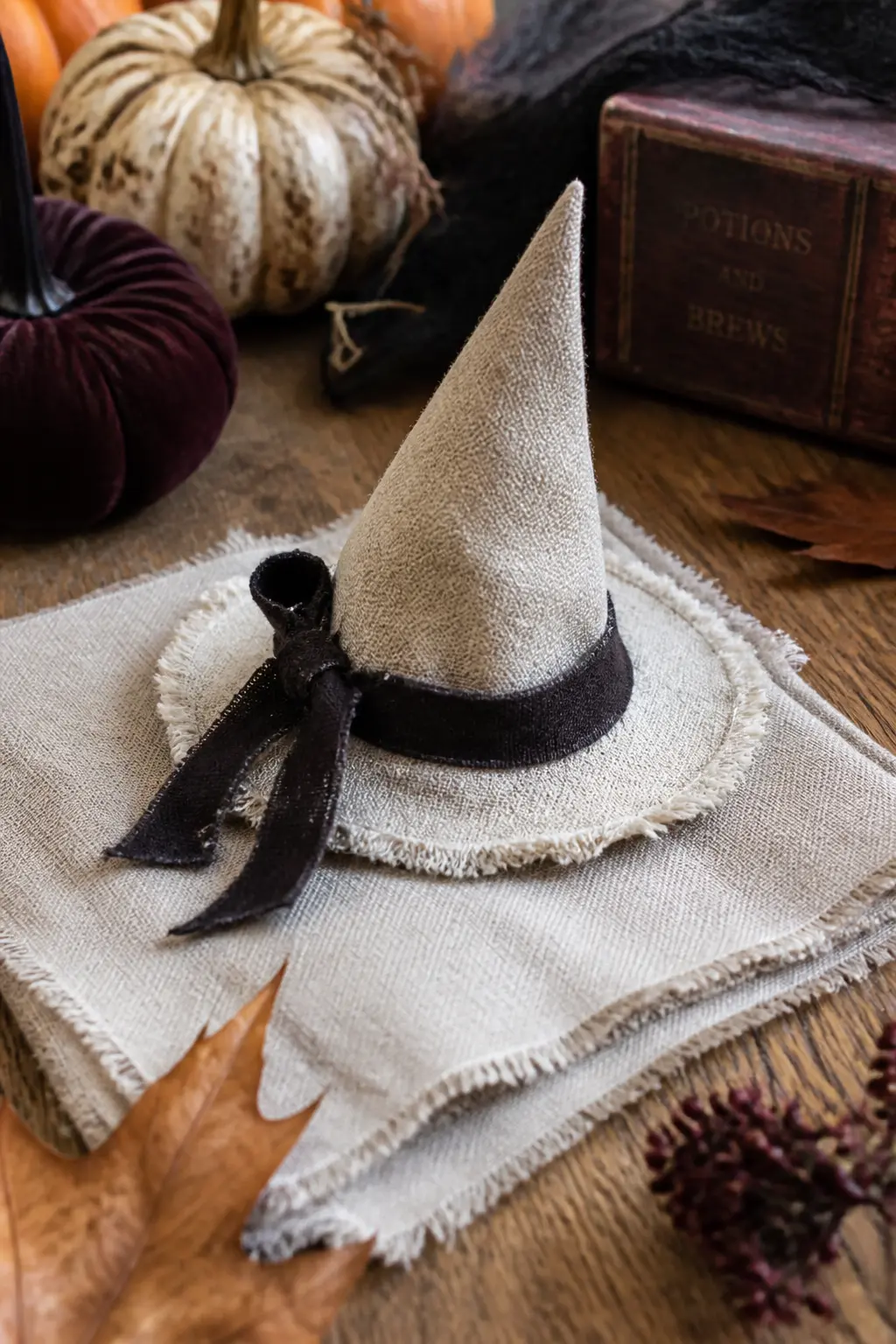 Raw-Edge Linen Witch Hat Fascinator — A miniature witch hat worn as a fascinator costs nothing if you have a scrap of stiff linen or buckram and about