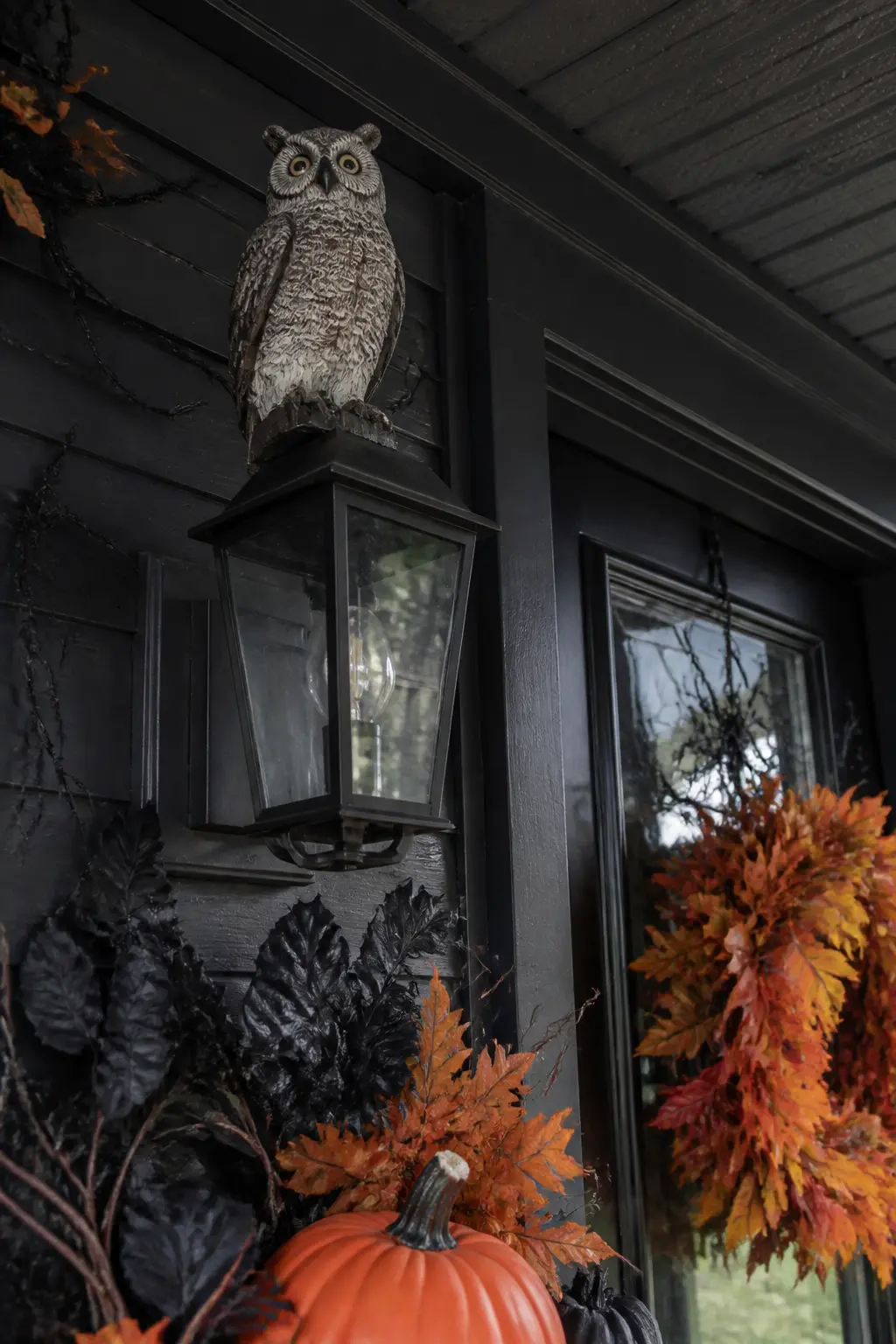 Owl Figure Perched on the Porch Light Fixture