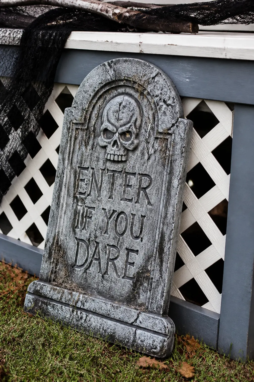 Tombstone Leaning Against the Porch Skirt