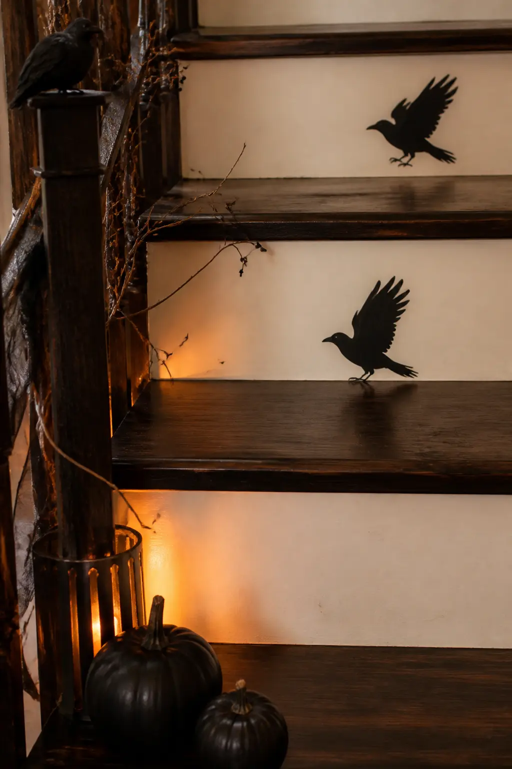 Raven Silhouette Step Risers — Print a single raven silhouette at full riser height, trace it onto black adhesive vinyl, and press one onto every other riser.