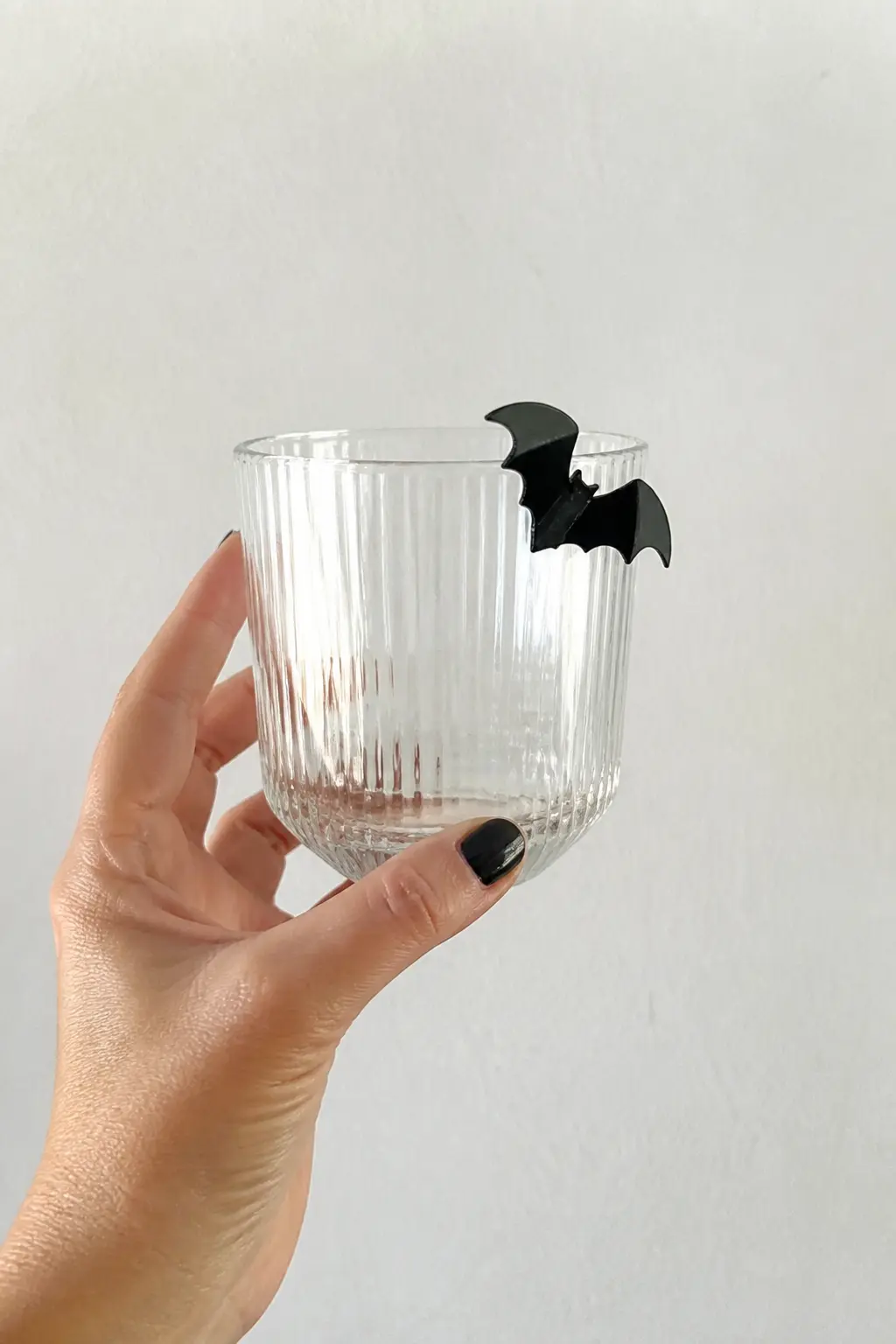 Black Acrylic Bat Charm — A 3mm black acrylic bat cut on a Cricut or laser cutter slots over the rim of any glass and perches there like it landed. Halloween