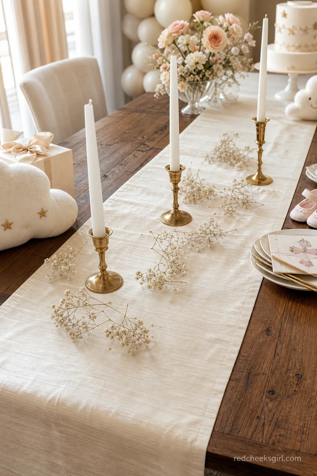 A Dupioni Silk Table Runner With Scattered Blooms — An ivory dupioni silk runner, laid the length of the table and scattered lightly with dried baby's breath