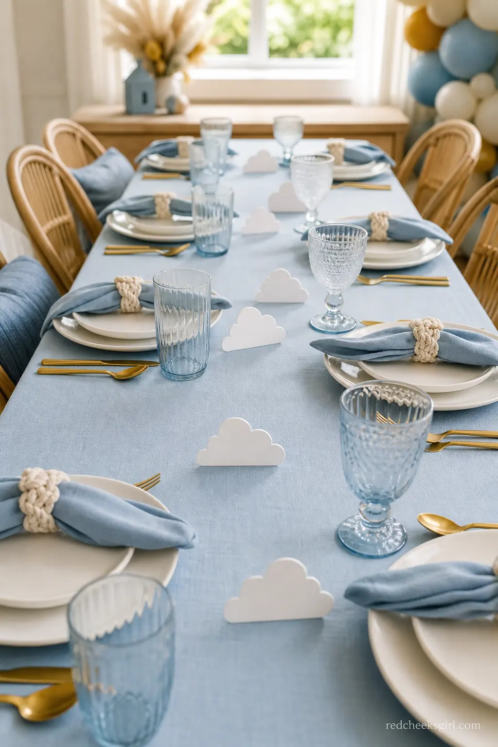 Cloud Paper Place Card Runner — Small die-cut paper clouds march down the centre of a pale blue tablecloth, each one doubling as a place card. Here comes the