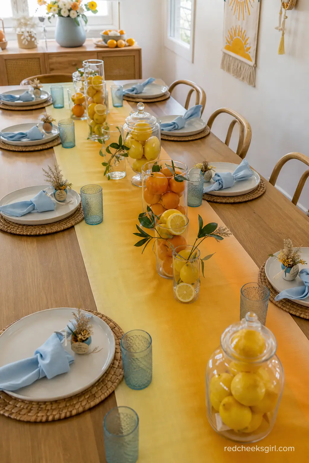 Sunrise Stripe Table Runner with Citrus Centerpiece — An ombre stripe runner moving from pale yellow to deep orange down the centre of the table does the color