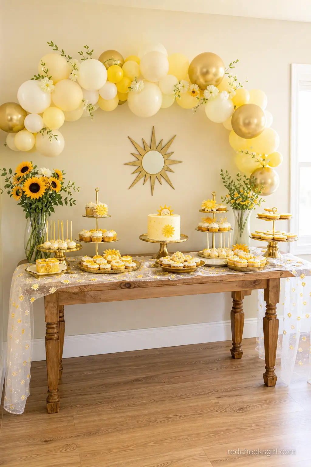 Gold Rim Dessert Table Setup — A dedicated dessert table in butter yellow and gold, tiered stands at different heights holding cookies, cupcakes and a small
