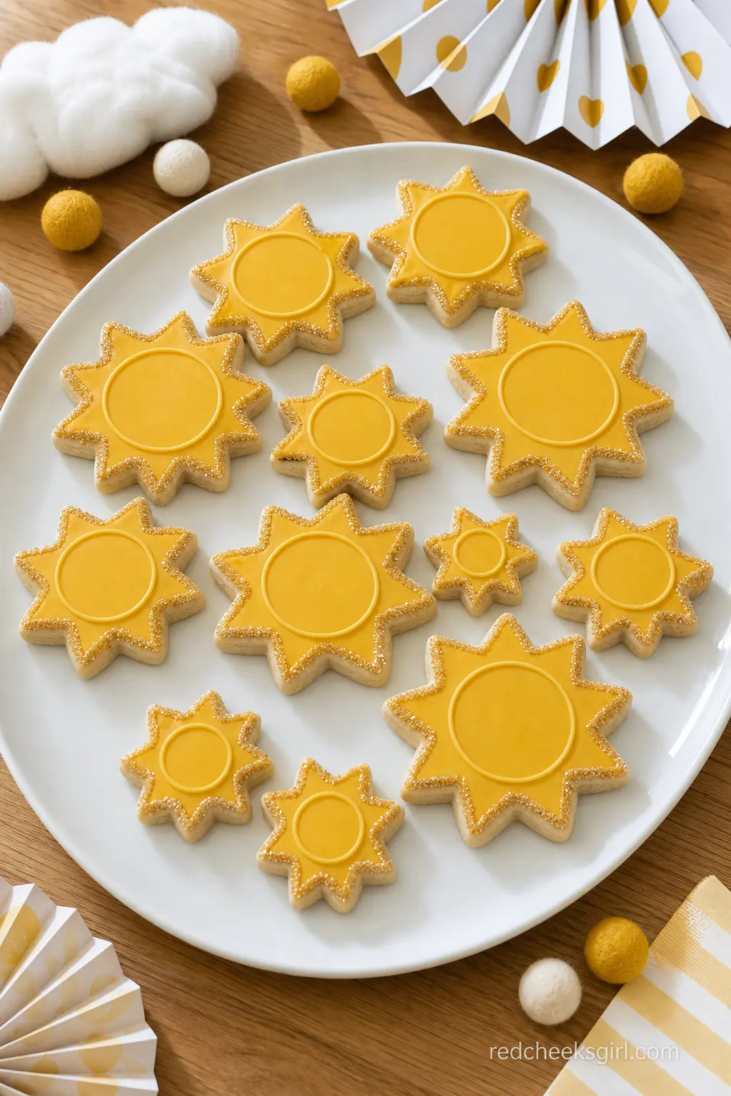 Sun Shaped Sugar Cookie Platter — A platter of iced sugar cookies cut into simple sun shapes, mustard royal icing with a thin gold sanding sugar edge, gives
