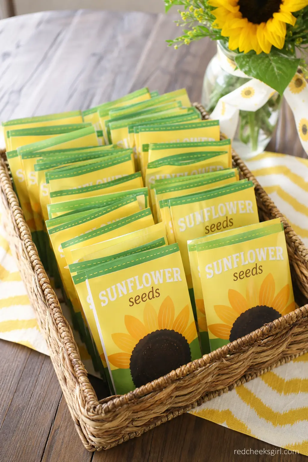 Sunflower Seed Packet Favors — Small seed packets printed with sunflowers, stacked in a low basket by the door, cost almost nothing and give guests something